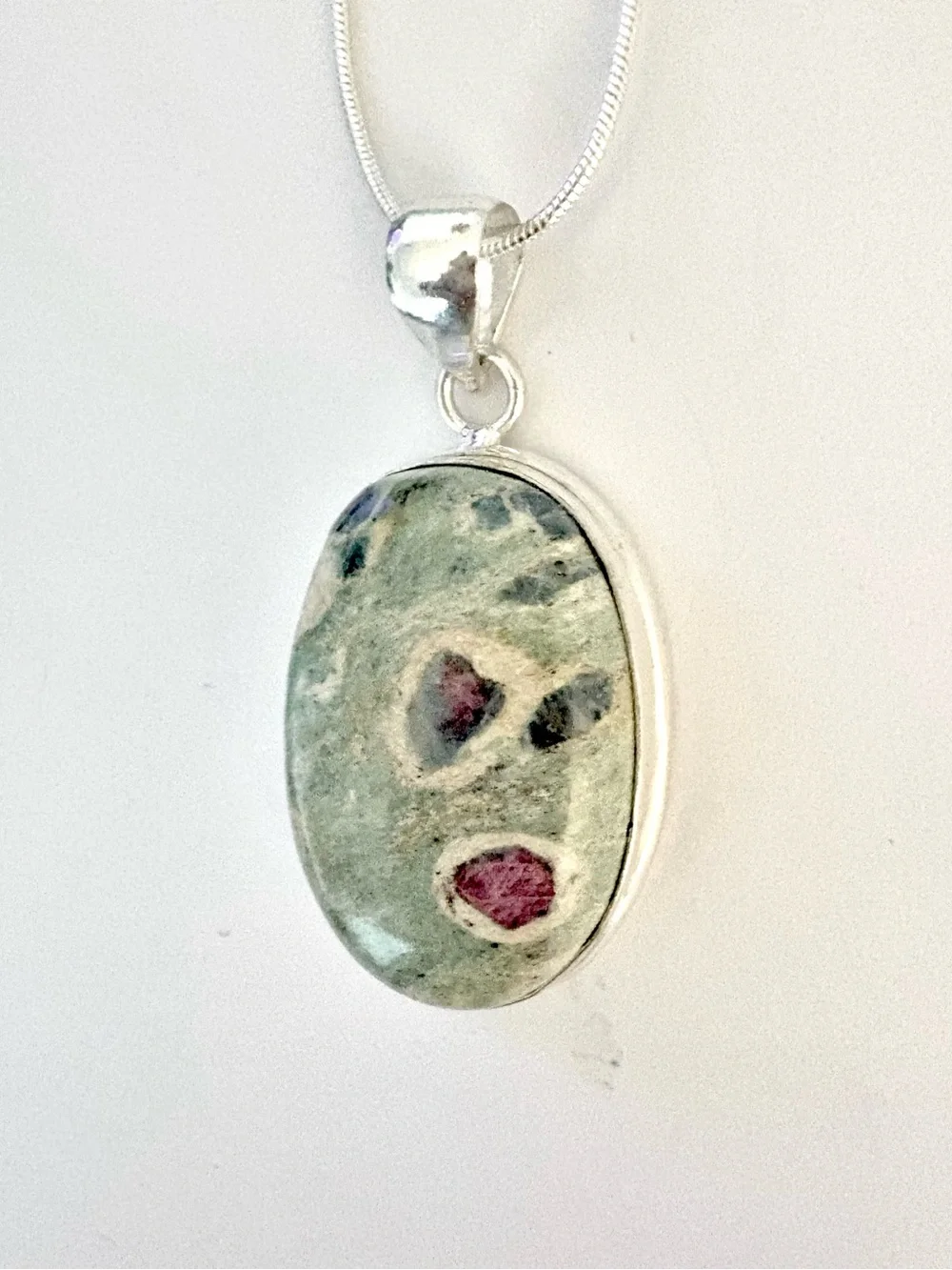 Beautiful, handcrafted, 2 inch Ruby Zoisite pendant on a silver chain.